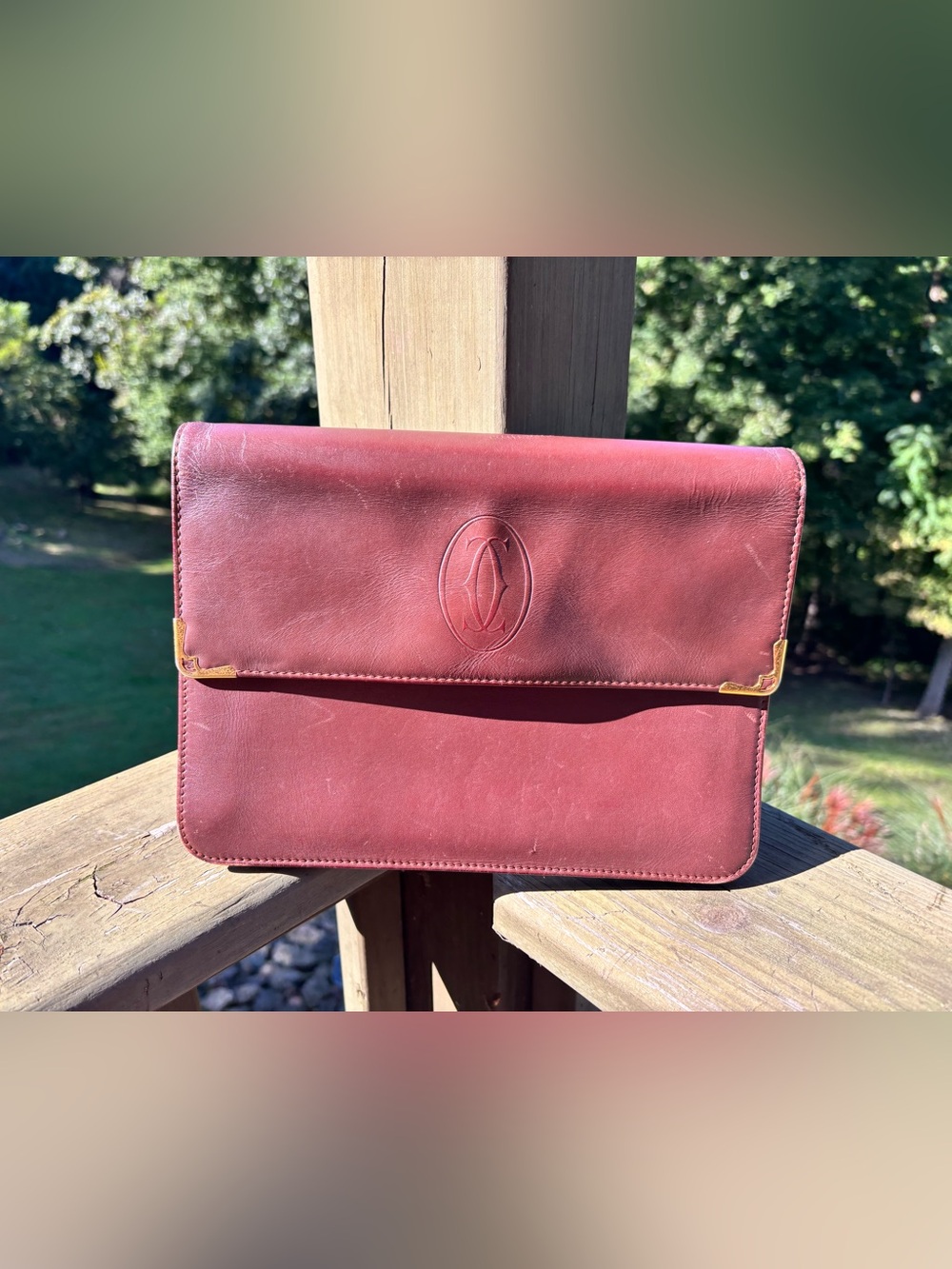 Cartier Leather Clutch in Burgundy with Embossed Crest